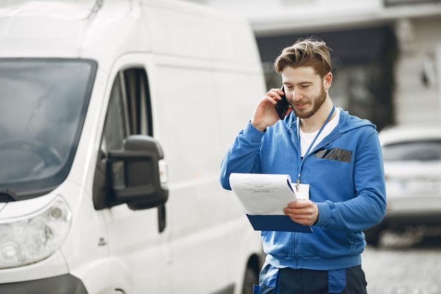 man by truck guy delivery uniform man with clipboard 1157 46192 Large
