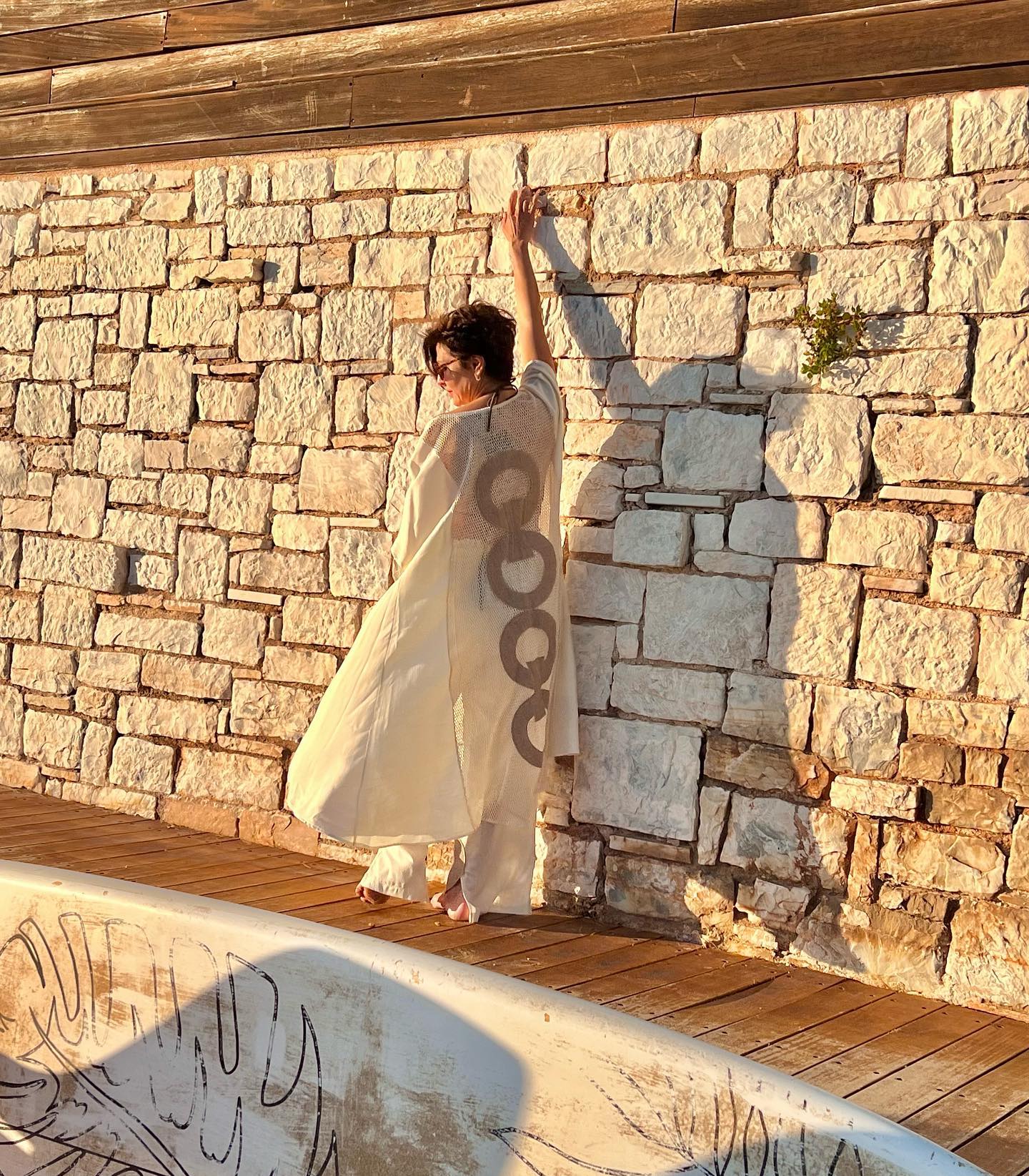 Photo by Tamilla Kulieva on April 20 2023. May be an image of 1 person sarong dress and the Western Wall