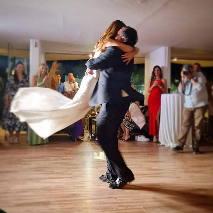 Photo by Elina Kefi on May 29 2023. May be an image of 7 people people dancing and wedding