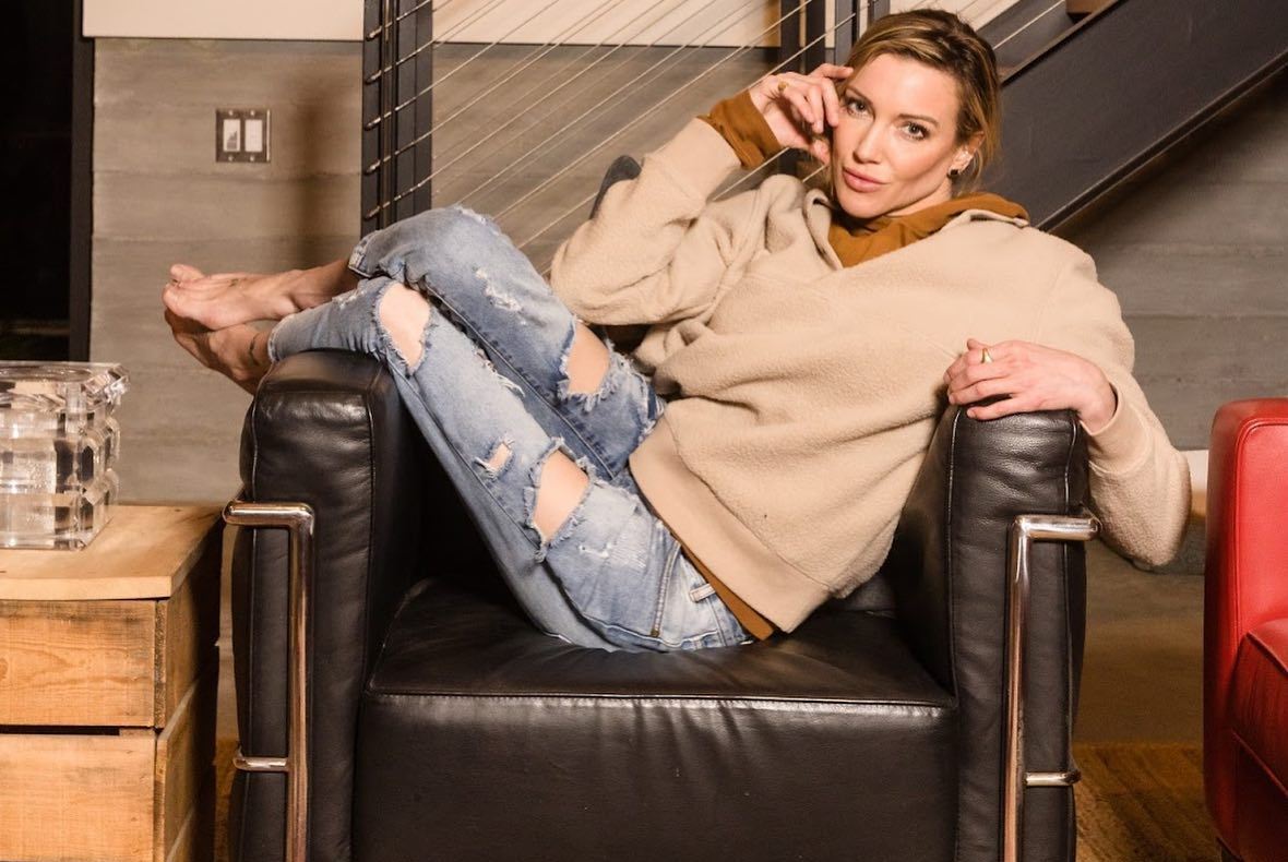 Photo by KATIE CASSIDY on March 16 2023. May be an image of 2 people turtleneck sofa and