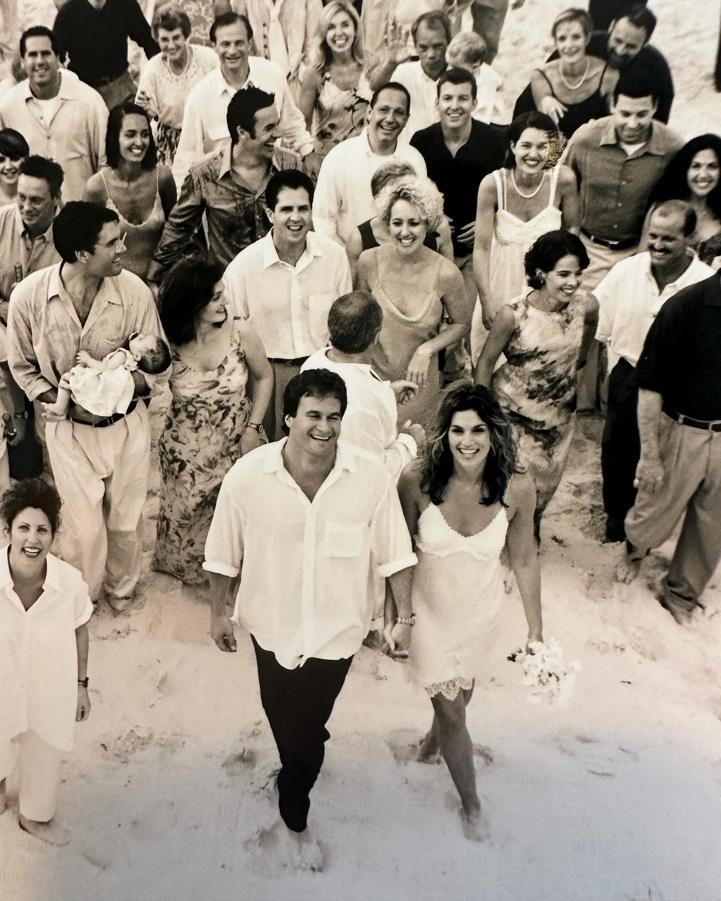 Photo shared by Cindy Crawford on May 29 2023 tagging @randegerber and @arthurelgort. May be an image of 7 people and wedding