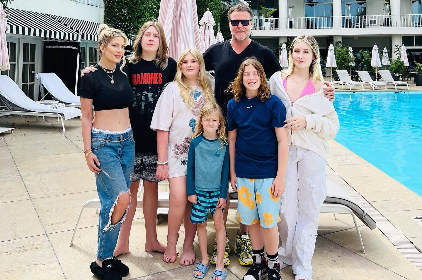Photo shared by Tori Spelling on June 15 2023 tagging @imdeanmcdermott @beverlyhilton @stella mcdermott08 @hattie mid and @liammcdermott . May be an image of 4 people blonde hair pool caba 001