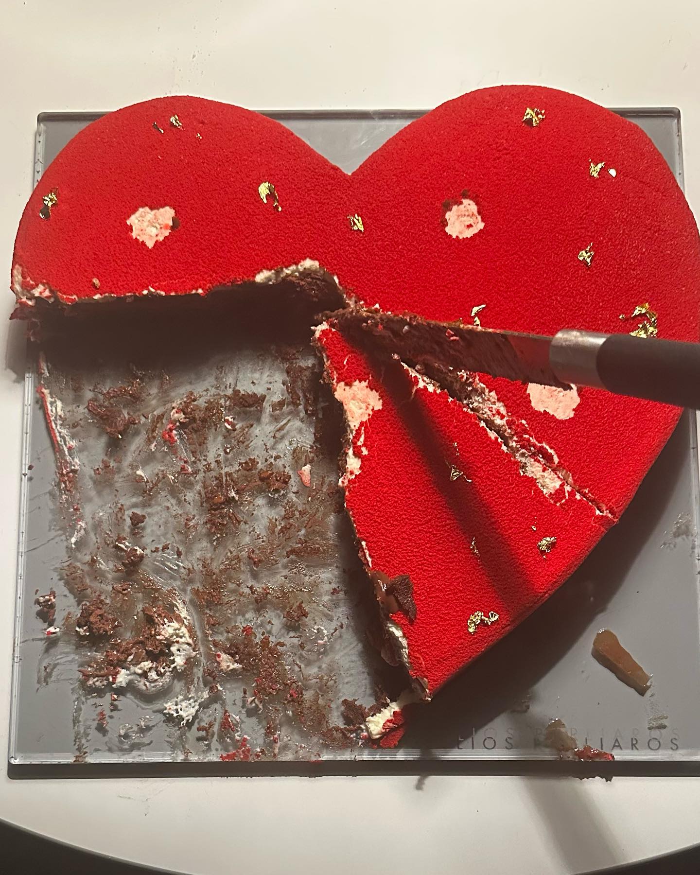 Photo by Genevieve Majari on July 12 2023. May be an image of heart chocolate cake and spatula