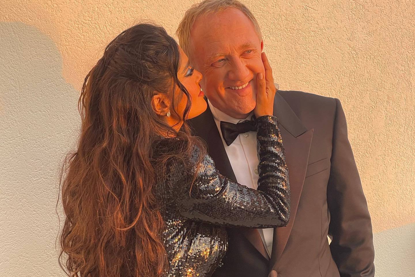 Photo by Salma Hayek Pinault on May 28 2023. May be an image of 2 people dinner jacket and