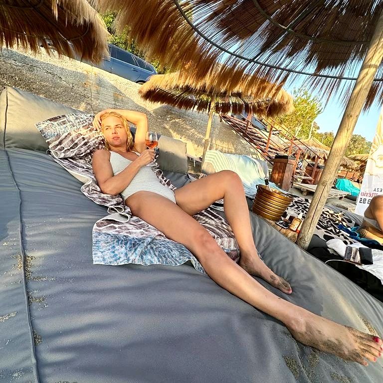 Photo by Marilena Radou on August 02 2023. May be an image of 1 person mosquito net towel beanbag chair sarong deck chair cabana and outdoors