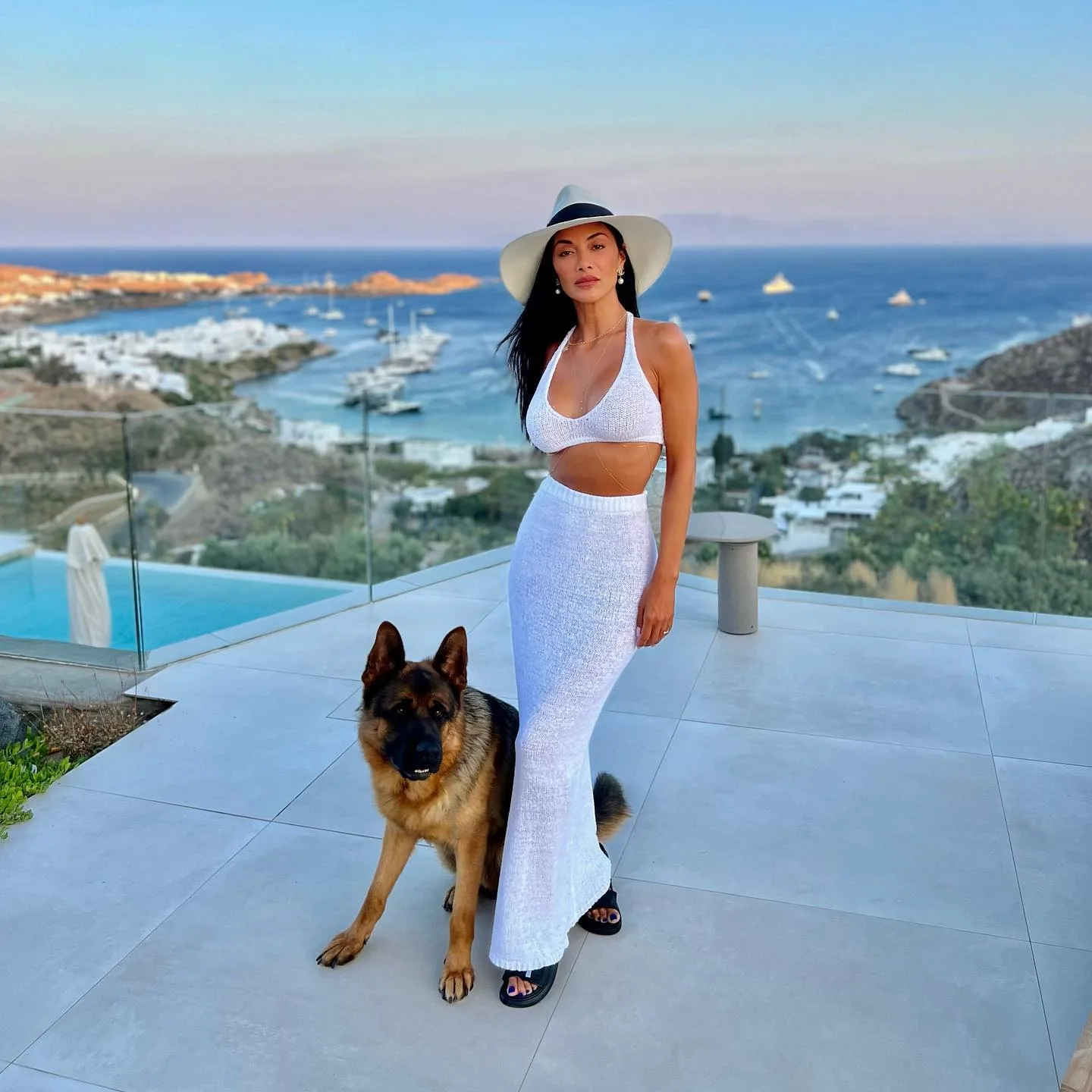 Photo by Nicole Scherzinger on July 09 2023. May be an image of 1 person Santorini and text jpg