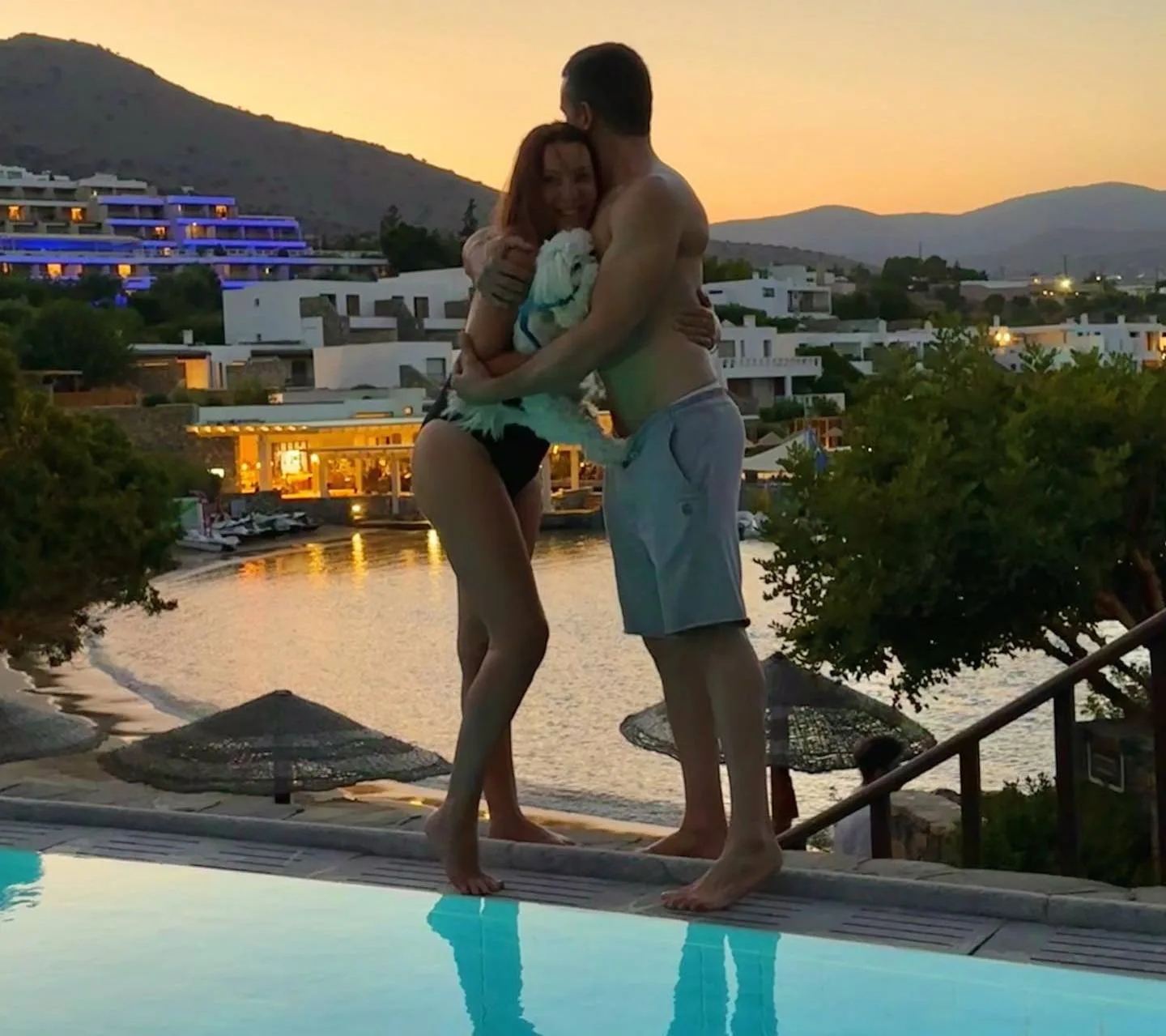 Photo by Panagiotis Rafailidis in Elounda Peninsula All Suite Hotel with @natalia germanou. May be an image of 1 person people kissing Santorini pool and twilight jpg