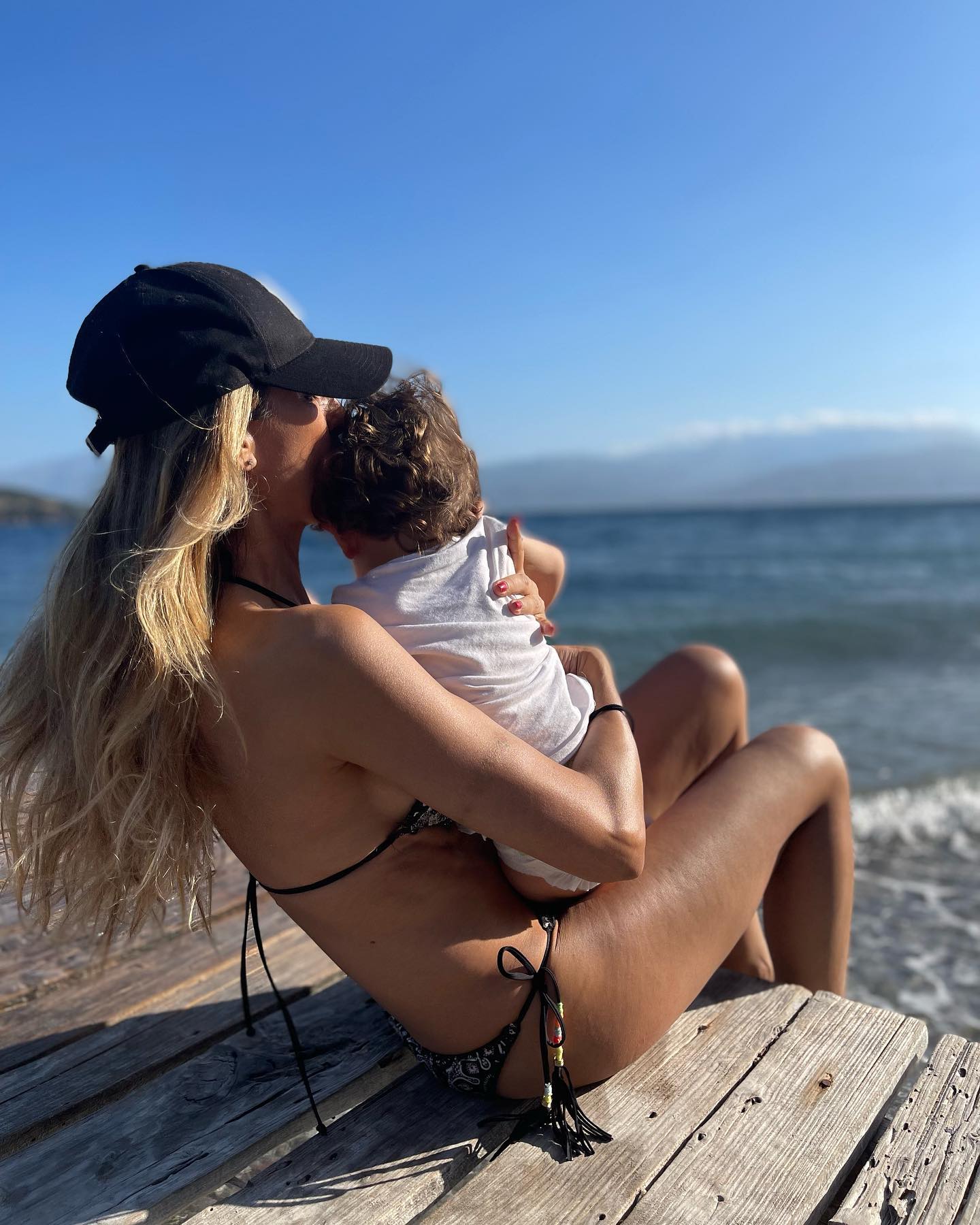 Photo by Roula Stamatopoulou on July 30 2023. May be an image of 1 person baby people kissing ocean and beach