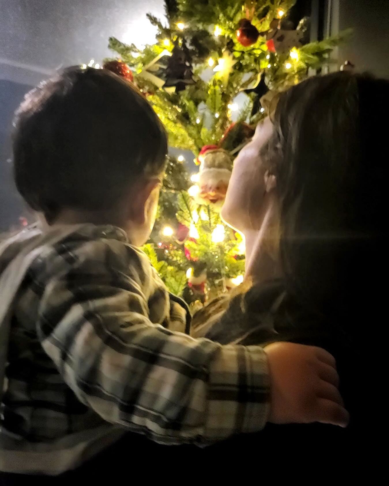 Photo by Chrysa Michalopoulou on December 12 2023. May be an image of 1 person baby people kissing christmas tree and tinsel