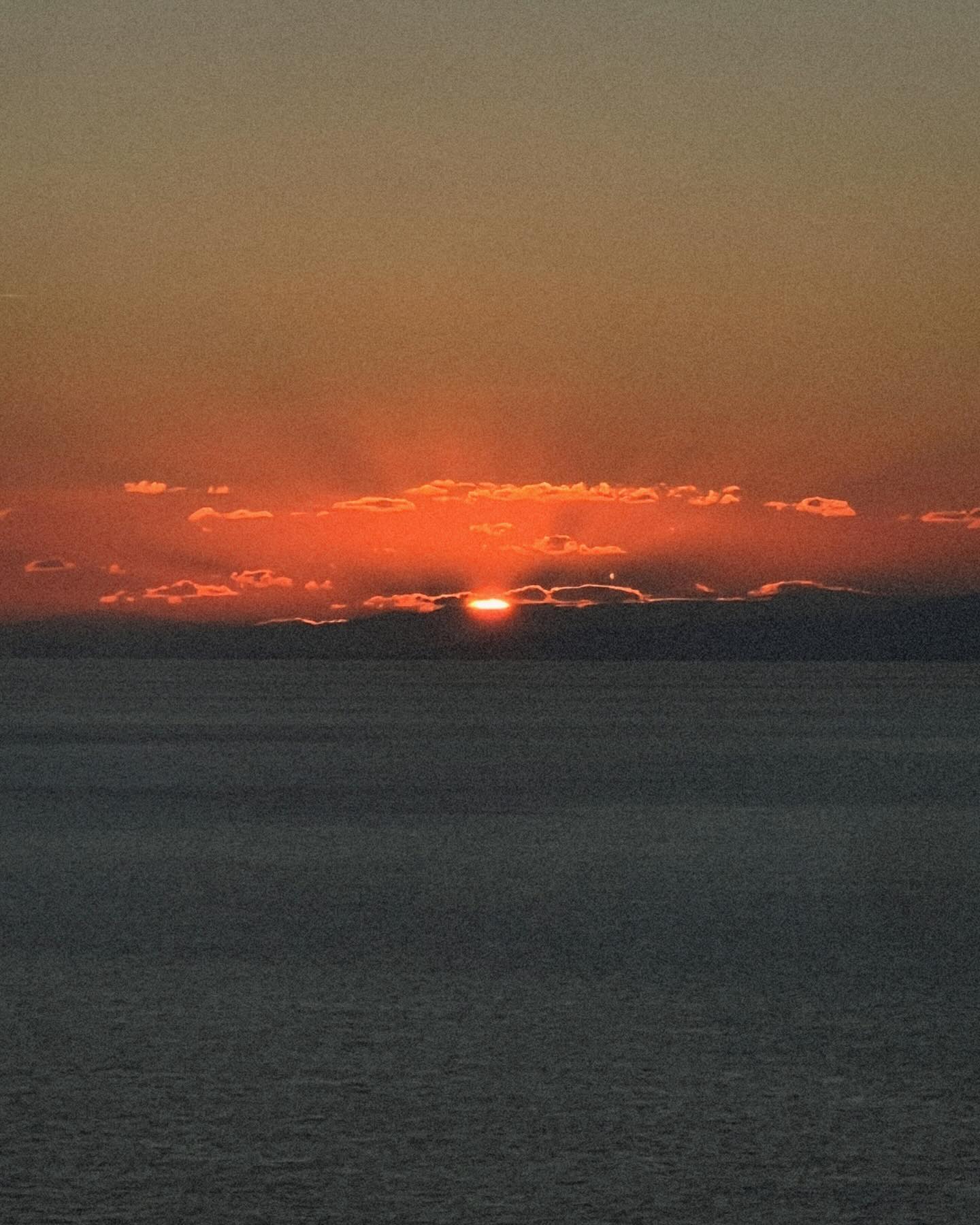 Photo by Evgenia Samara on January 14 2024. May be an image of ocean horizon twilight eclipse and sky