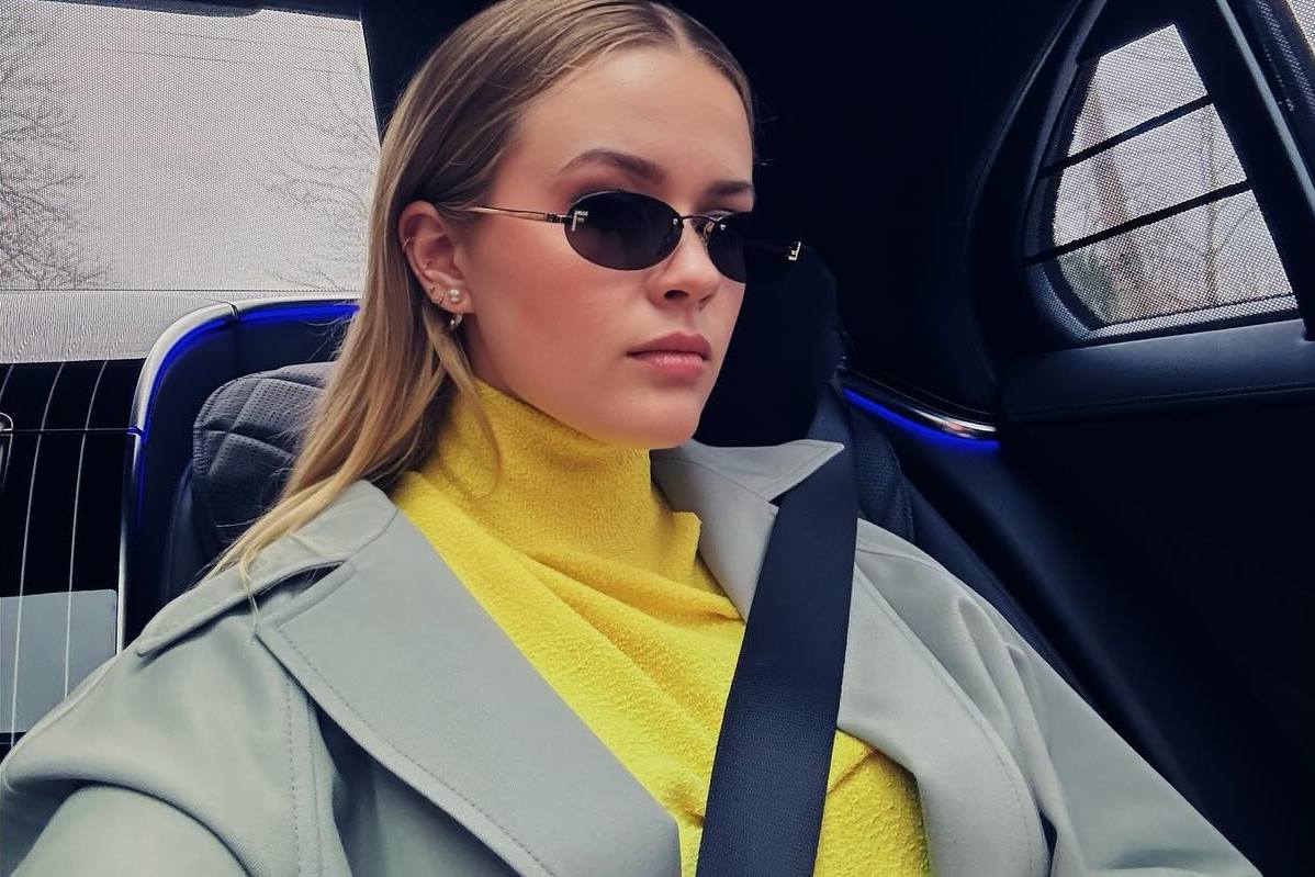 Photo shared by ava on January 25 2024 tagging @fendi. May be an image of 1 person makeup car seatbelt turtleneck and sunglasses